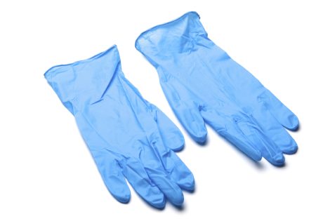 Pair of blue, wrinkled surgical gloves against white background. No selection made.